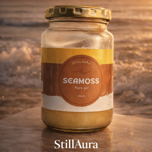 Jar of Seamoss with StillAura branding on a wooden surface with a sunset background